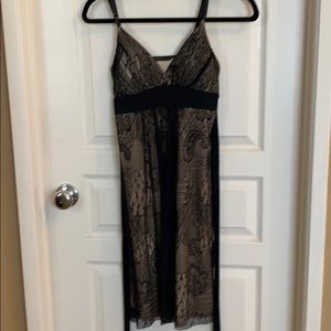 Knee length black dress.